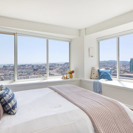 Large windows offer light-filled living with spectacular city views