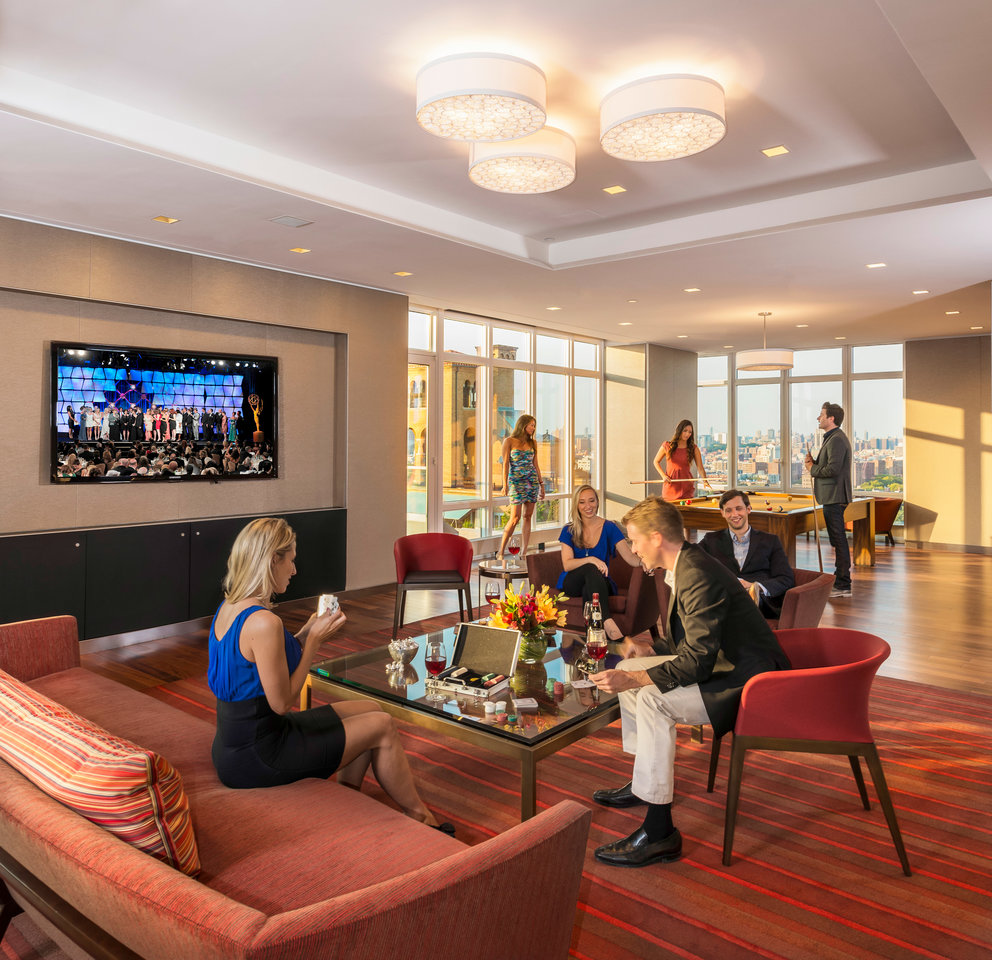 Located on the 20th floor with breathtaking Central Park views, the entertainment lounge features a 20-by-60 foot sitting area, billiards, a walnut paneled bar, and Venato Travertine hearth.