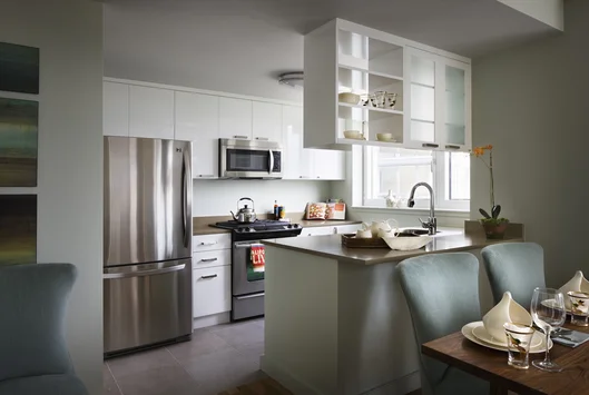 Gourmet kitchens feature high-gloss white cabinetry