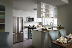 Gourmet kitchens feature high-gloss white cabinetry