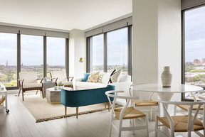 Spacious living rooms have nine-foot ceilings with floor-to-ceiling windows.