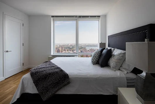 Light filled living rooms offering stunning views of New York City.