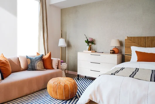 Bedrooms feature wide-plank flooring throughout and spacious closets with Elfa shelving systems.