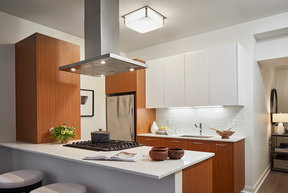 Gourmet kitchens with Snaidero duotone cabinetry and quartz countertops.