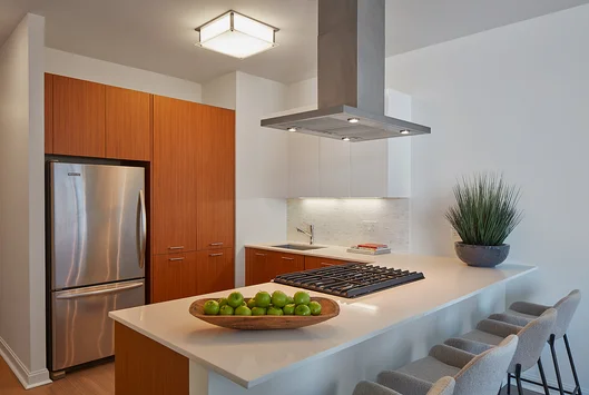 Custom-designed wide-plank wood flooring throughout residences