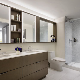 Custom bathrooms include imported Bianco Dolomite polished marble with marble mosaic feature walls.