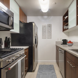 Gourmet granite kitchens with European-style glass door cabinetry, ceramic tile floors and stainless steel appliances will bring out your inner chef.