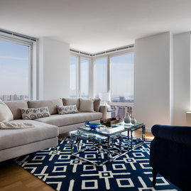 Light filled living rooms offering stunning views of New York City.