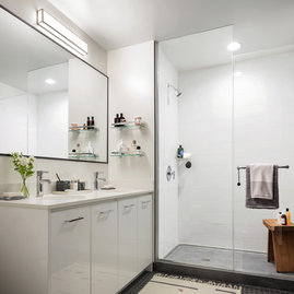 Classically tiled bathrooms feature oversized medicine cabinets.