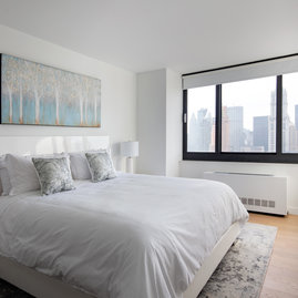 Open bedrooms feature stunning views and warm, inviting lighting.