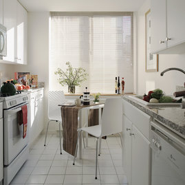 Gourmet stone kitchens feature stainless steel appliances and Euro-style cabinetry.