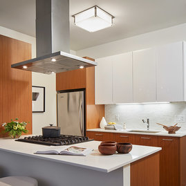 Gourmet kitchens with Snaidero duotone cabinetry and quartz countertops.
