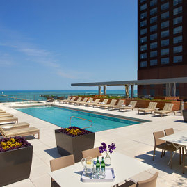Take a dip in the rooftop pool, then enjoy the lake views from under a shaded cabana.