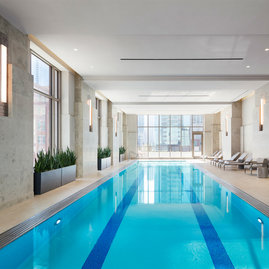 60 ft. indoor pool with access to an outdoor terrace overlooking Bennett Park.