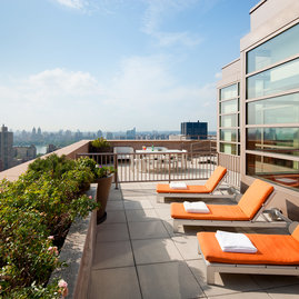 This lushly landscaped sun terrace complete with lounge chairs, tables and chairs provides the perfect setting to relax, refresh and recharge while enjoying views of the city.