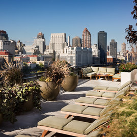 Take in the view from a lounge chair on the building's landscaped rooftop sun terrace.