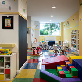 Children's playroom stocked with toys, books, and games.