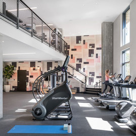 State-of-the-art fitness center with cardiovascular machines and Tonal’s strength-training system
