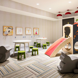 Families enjoy the children's playroom, designed with plenty of space for young explorers to get the wiggles out.