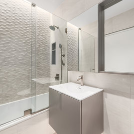 Bathrooms are equipped with heated floors, rain shower head system, and stainless steel plumbing. 
