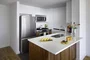 Gourmet kitchens feature stainless steel appliances. 