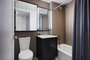 Custom Bathrooms feature marble baths with oversized custom medicine cabinets