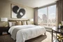 Over-sized windows frame Central Park, the river and open city views.