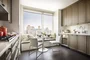 Top-of-the-line appliance suite featuring stainless steel refrigerator, gas range with oven, microwave in custom millwork pantry and integrated dishwasher.