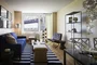 Open living and dining areas filled with light.