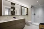 Custom bathrooms include imported Bianco Dolomite polished marble with marble mosaic feature walls.