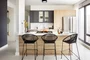 Modern kitchens include Bosch appliances, refined subway tile backsplash, quartz countertops, stainless steel shelving, and stainless steel single bowl sink.