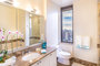Lavish baths with polished marble floors and vanities provide unmatched luxury.