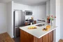 Gourmet kitchens feature stainless steel appliances. 