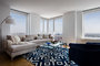 Light filled living rooms offering stunning views of New York City.