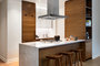 Custom kitchen cabinetry with matte black hardware, Turkish marble countertop and backsplash designed by Andre Kikoski Architect.