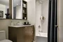 Custom bathrooms include imported Bianco Dolomite polished marble with marble mosaic feature walls