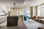 Kitchens feature Subzero built-in refrigerator, bottom mount freezer, Bosch Benchmark appliances including electric oven, gas cooktop, integrated dishwasher and microwave drawer.