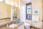 Lavish baths with polished marble floors and vanities provide unmatched luxury.