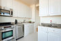 Layouts feature gourmet kitchens with paneled white cabinet doors, stainless steel appliances and granite counters.