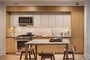 Italian designed and manufactured kitchens with custom oak cabinetry, natural Brazilian quartzite countertops and backsplash.