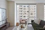 Custom-designed wide-plank wood flooring throughout residences