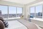Large windows offer light-filled living with spectacular city views