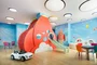 Children's playroom stocked with toys, books, and games.