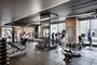 Equinox®-curated fitness center with yoga room, locker rooms and steam shower