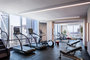 Equinox®-curated fitness center with yoga room, locker rooms and steam shower