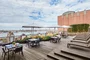 The landscaped rooftop sun terrace provides a perfect setting for enjoying gorgeous views of the city and the Hudson River.
