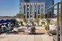 The lushly landscaped sun terrace is furnished with lounge chairs and shaded cabanas.