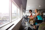 Private on-site fitness center includes ample natural light.