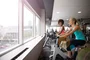 Private on-site fitness center includes ample natural light.
