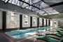 A skylit sixty foot heated swimming pool is adjacent to a state-of-the art health and fitness center. 